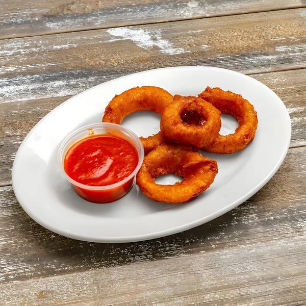 Golden-brown onion rings and a cup of red dipping sauce on a white plate at Roma Pizza Restaurant.